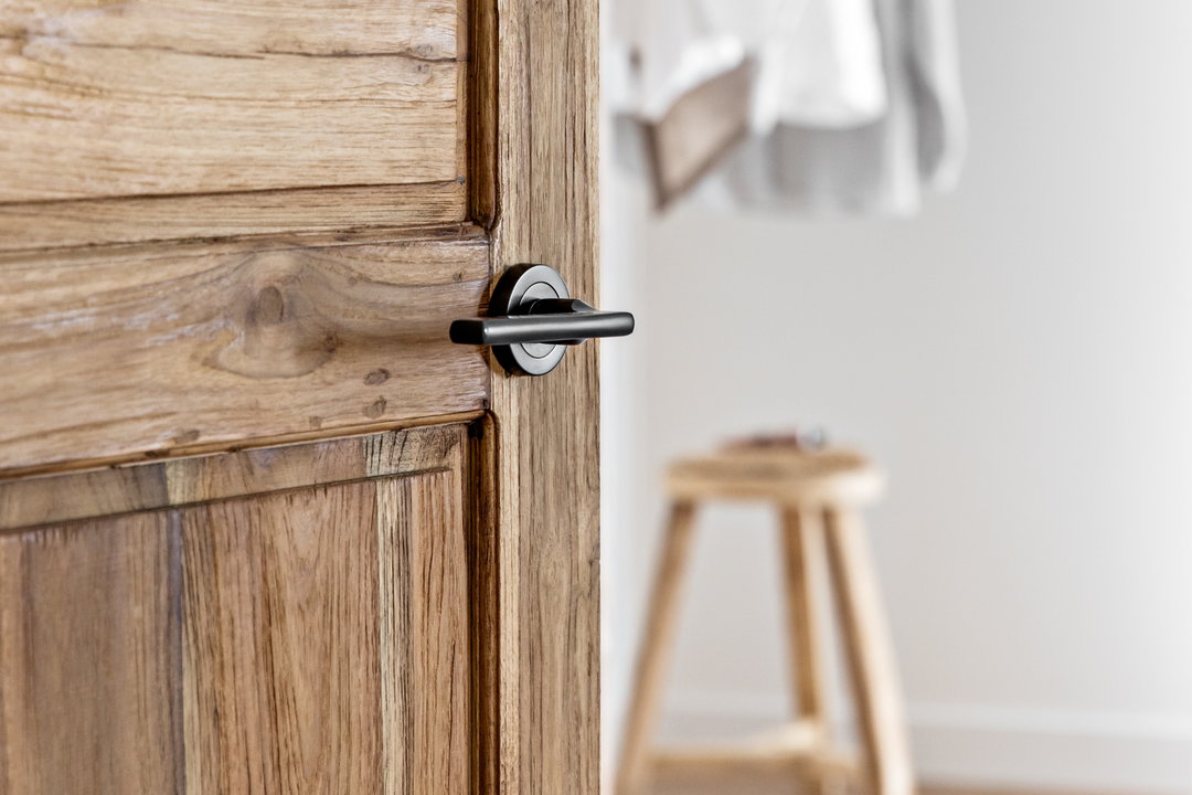 Timber door with Baltimore Lever in Signature Brass