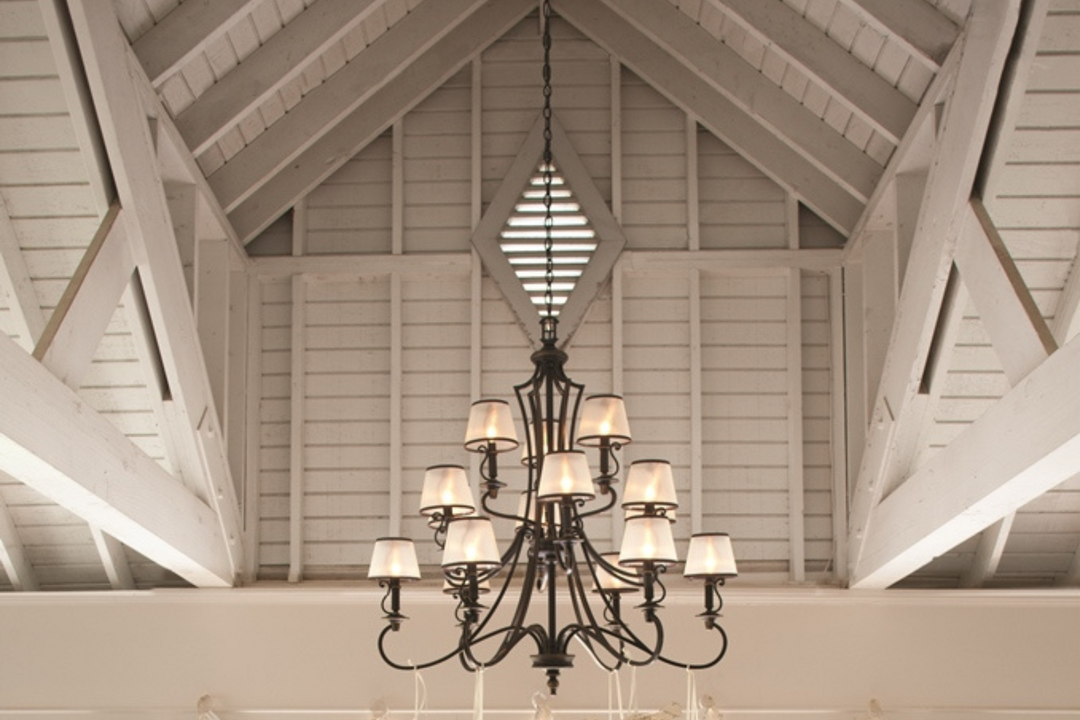 Converted barn featuring Elstead Plymouth chandelier