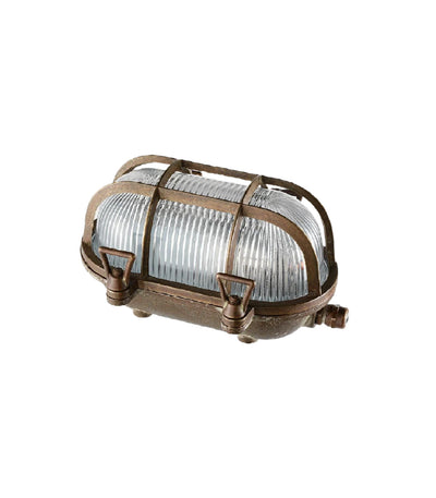 Vintage-style metal light fixture with clear glass on a white background