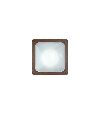 Square wall light fixture with aged brass frame on a white background