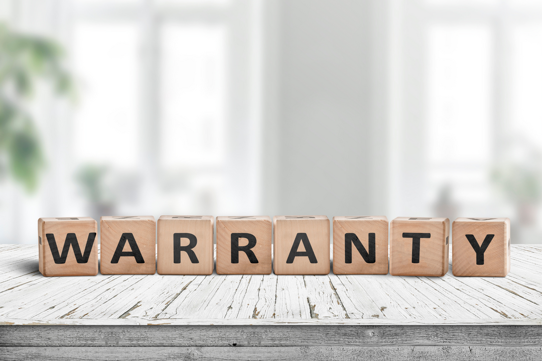 Wooden blocks spelling the word warranty